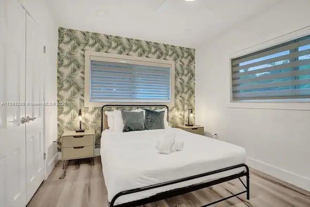 bedroom featuring a closet and light wood-type flooring