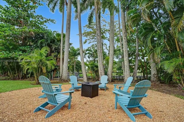 surrounding community with a playground, a yard, volleyball court, and a shed