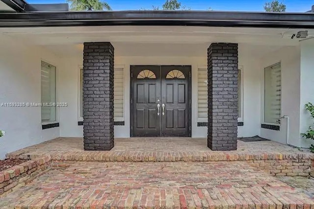 doorway to property featuring a porch