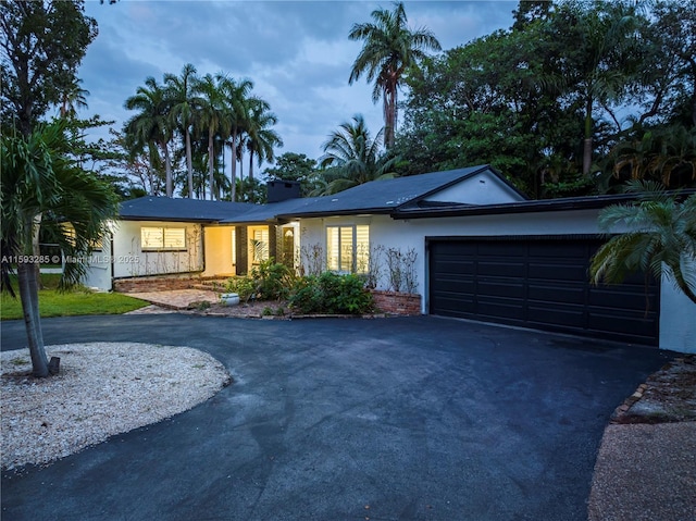 ranch-style home with a garage