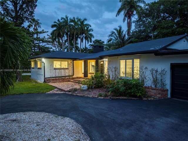 ranch-style home with a garage