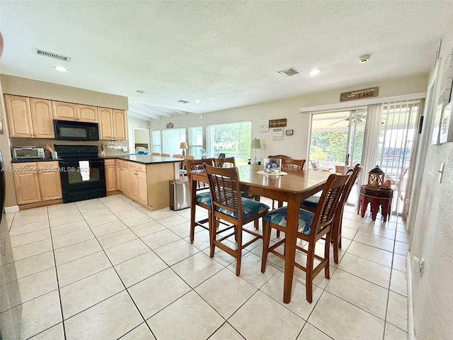 dining room featuring ceiling fan and light tile flooring