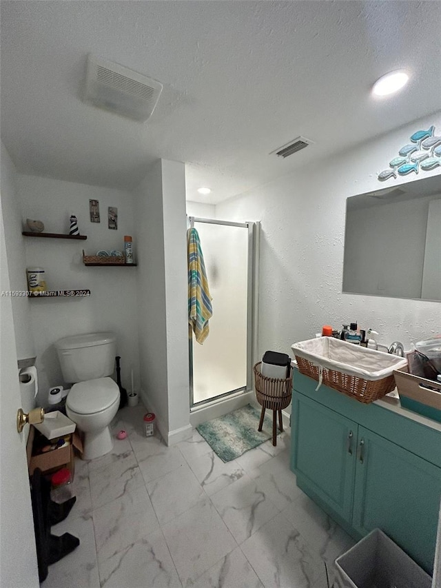 bathroom featuring a textured ceiling, tile floors, a shower with shower door, vanity, and toilet