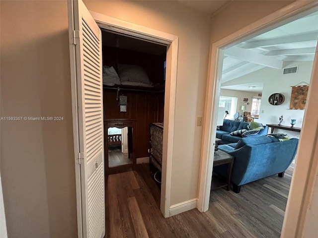 hallway with vaulted ceiling with beams and dark hardwood / wood-style flooring