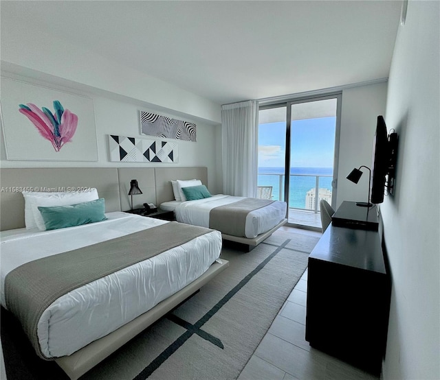 bedroom featuring floor to ceiling windows and access to outside