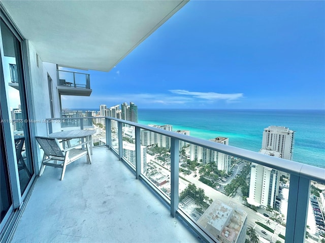 balcony featuring a water view