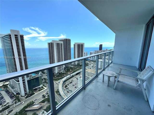 balcony featuring a water view