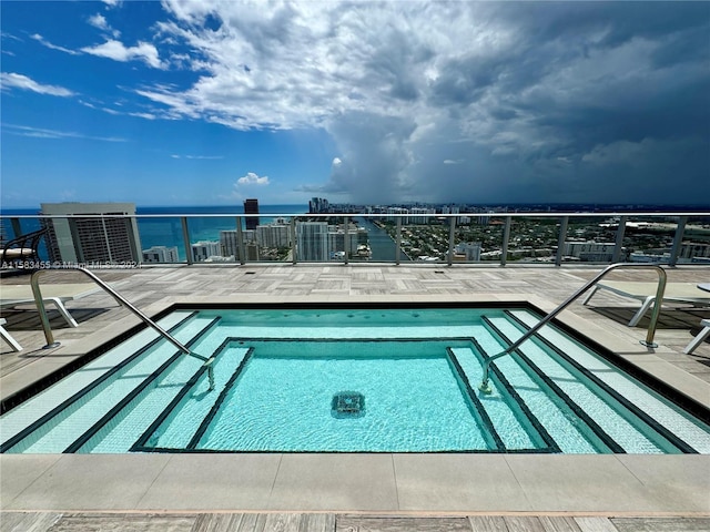 view of pool featuring a water view