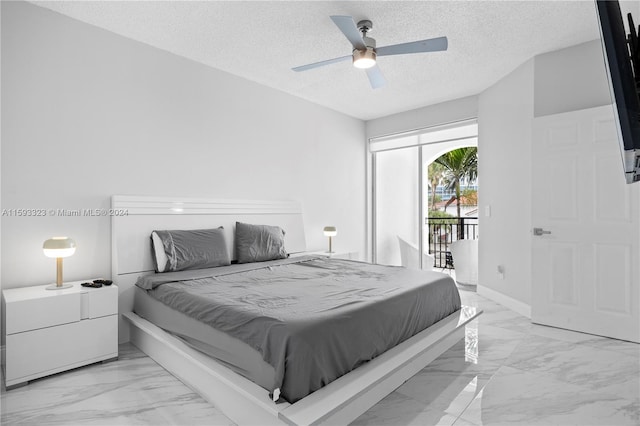 tiled bedroom featuring a textured ceiling, ceiling fan, and access to exterior