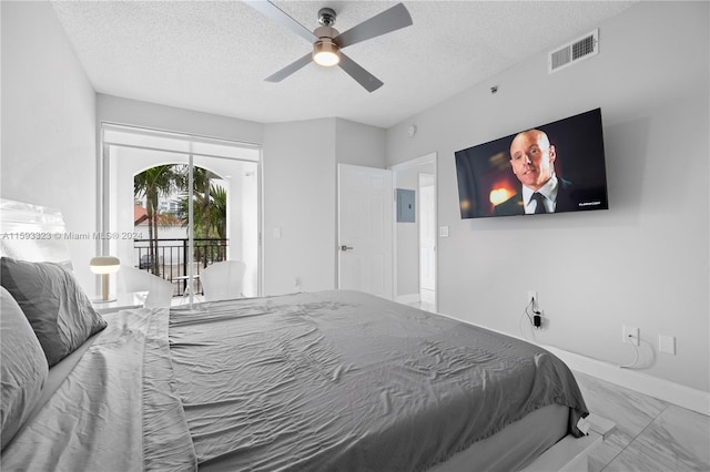 bedroom featuring tile flooring, ceiling fan, access to exterior, and a textured ceiling