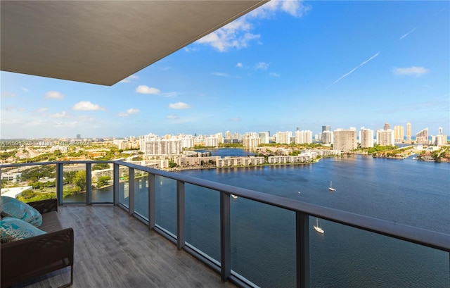 balcony featuring a water view