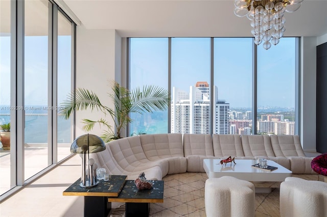 living room with a notable chandelier and a wall of windows