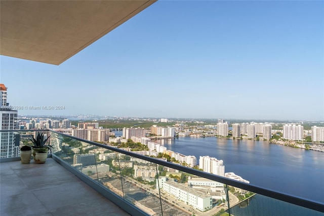 balcony featuring a water view