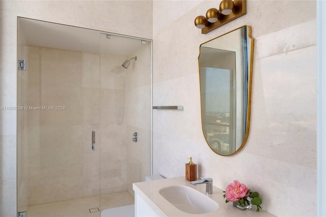 bathroom with an enclosed shower and large vanity