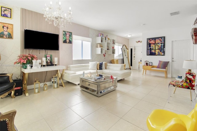 living room featuring tile patterned flooring and an inviting chandelier