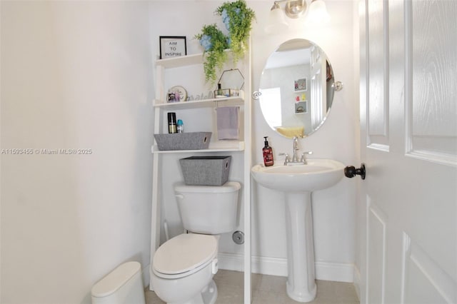 bathroom with toilet and sink