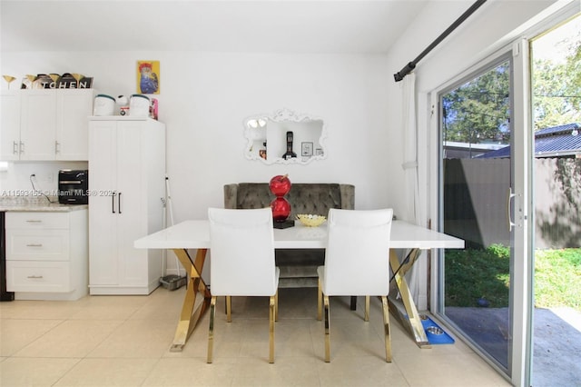 dining area featuring a healthy amount of sunlight and light tile patterned floors