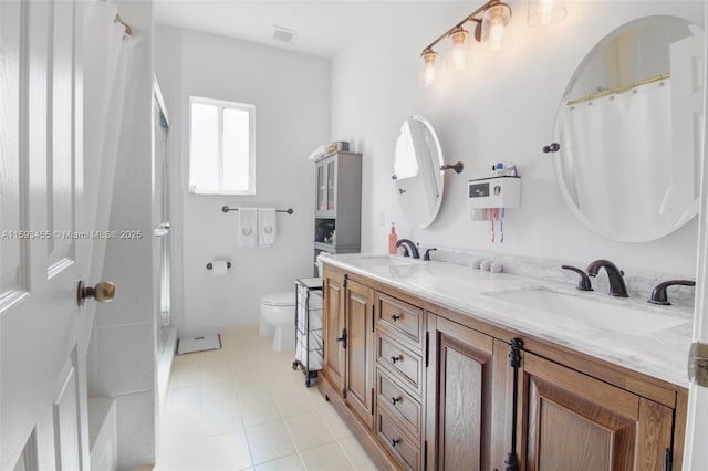 bathroom featuring a shower with curtain, vanity, toilet, and tile patterned flooring