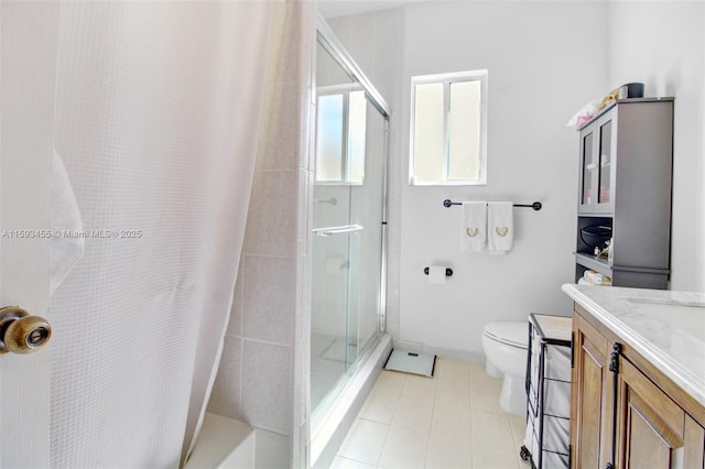 bathroom featuring vanity, tile patterned flooring, toilet, and a shower with shower curtain