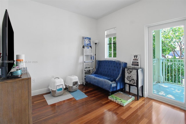 sitting room with dark hardwood / wood-style flooring