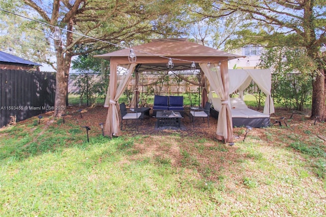 view of yard with a gazebo and an outdoor hangout area