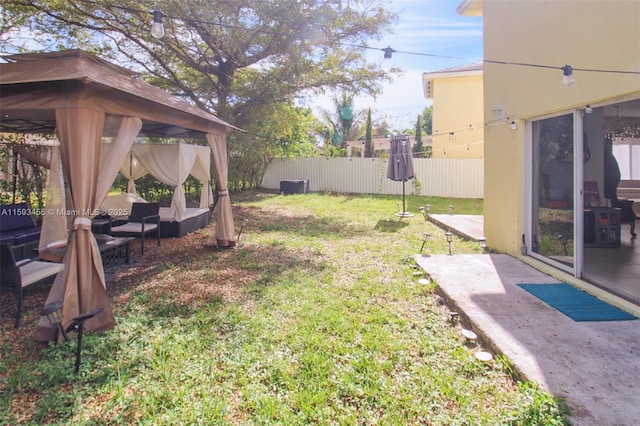 view of yard featuring a gazebo and a patio area