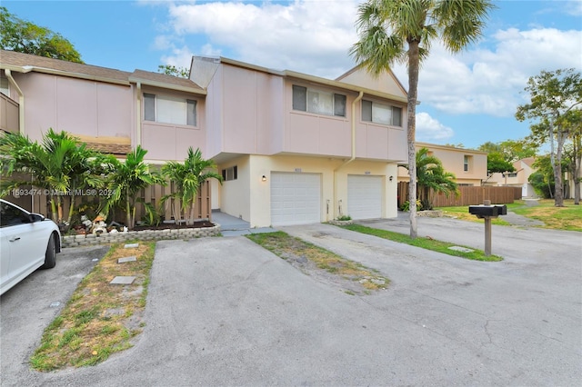 townhome / multi-family property featuring a garage