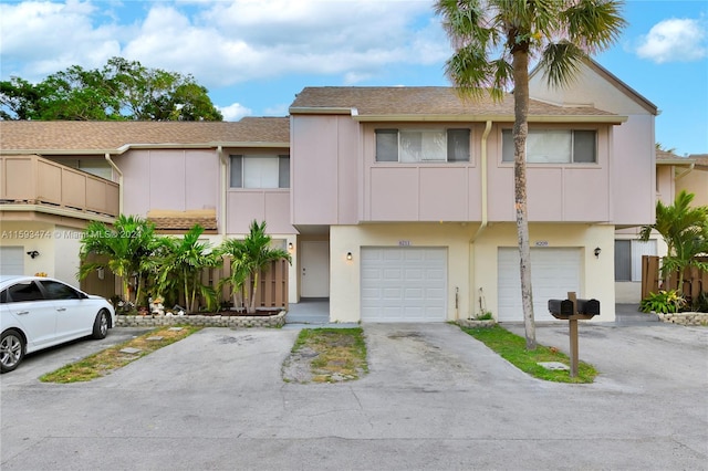 townhome / multi-family property featuring a garage