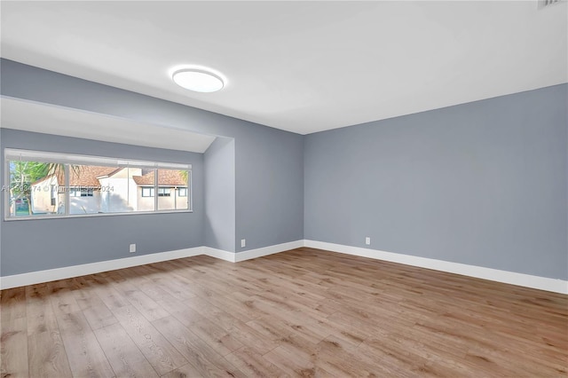 unfurnished room featuring light hardwood / wood-style floors