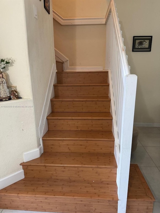 staircase with tile floors