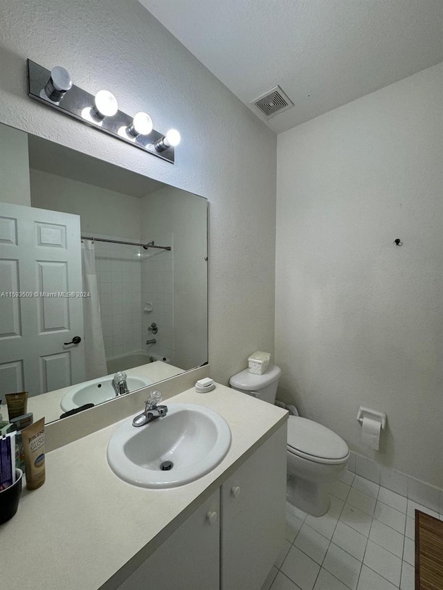 full bathroom with tile floors, shower / tub combo, oversized vanity, and toilet