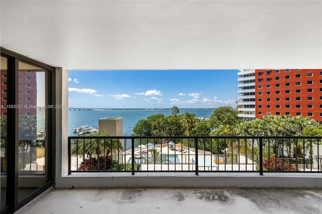 balcony featuring a water view