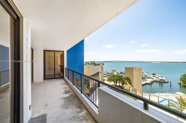 balcony featuring a water view