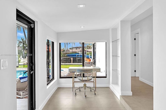 office area with a healthy amount of sunlight and light tile patterned flooring