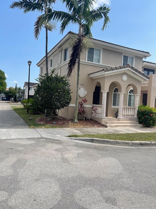 mediterranean / spanish-style home featuring a porch