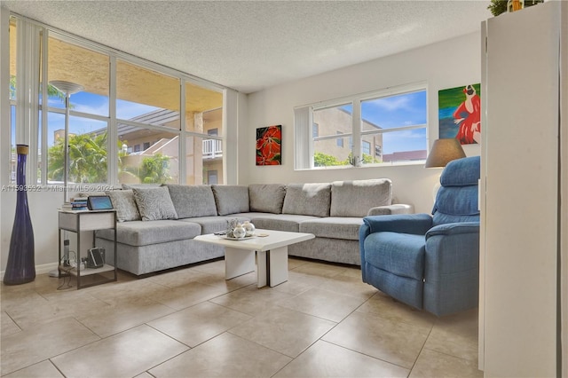 living room featuring a textured ceiling and light tile flooring