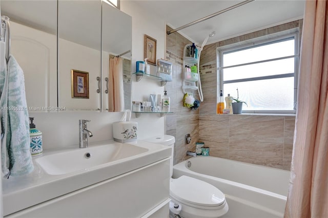 full bathroom with vanity, toilet, and shower / tub combo with curtain