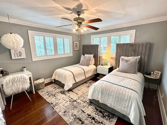 bedroom with dark hardwood / wood-style flooring, ornamental molding, and ceiling fan