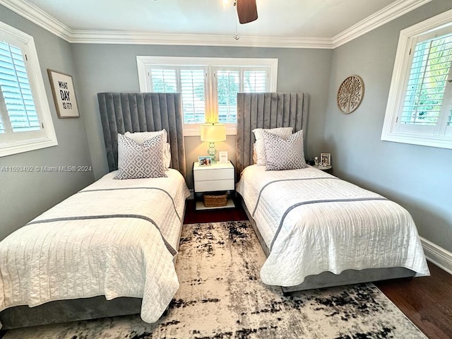 bedroom with ceiling fan, multiple windows, ornamental molding, and dark hardwood / wood-style flooring