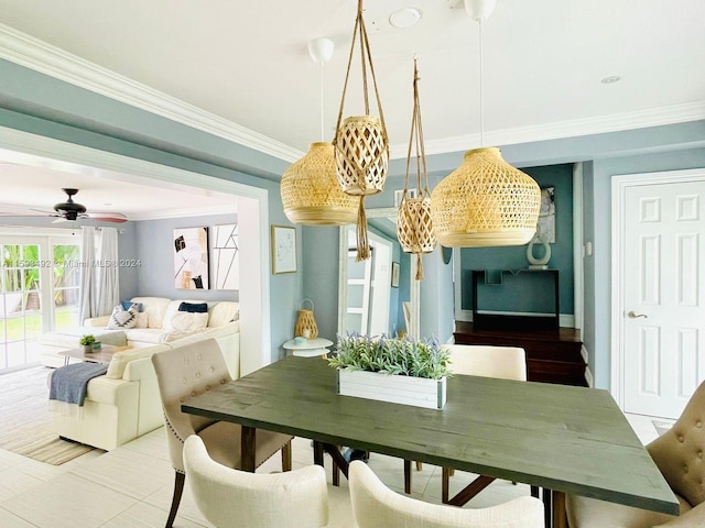 dining room featuring ceiling fan, ornamental molding, and wood-type flooring