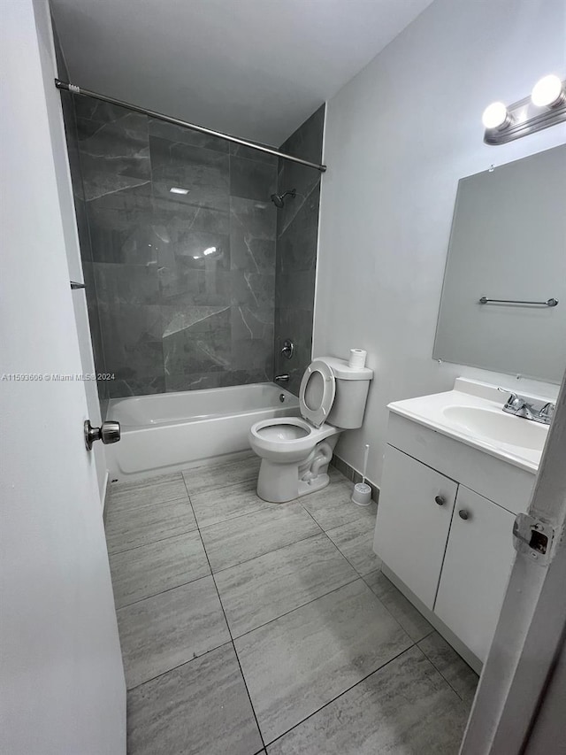 full bathroom with vanity, toilet, and tiled shower / bath