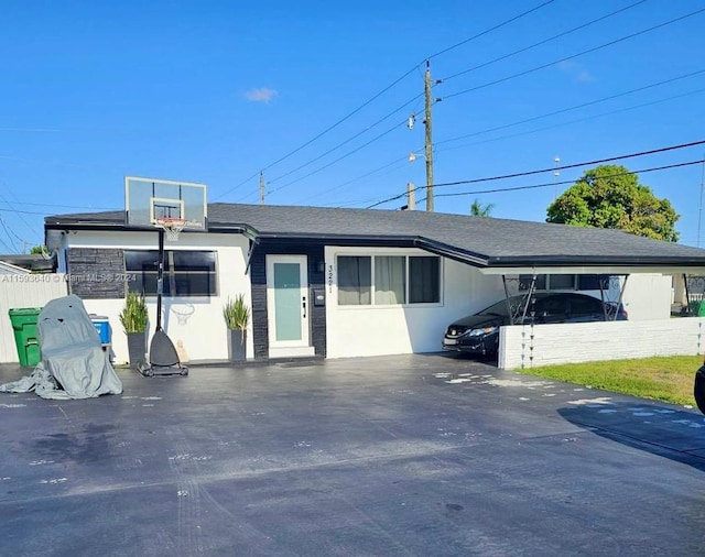 view of front of home featuring a carport