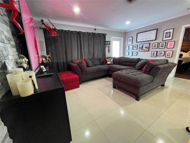 tiled living room featuring ornamental molding