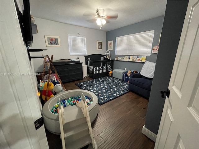 bedroom featuring ceiling fan and dark hardwood / wood-style flooring