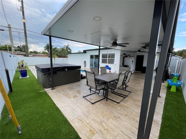 view of patio featuring a hot tub and ceiling fan