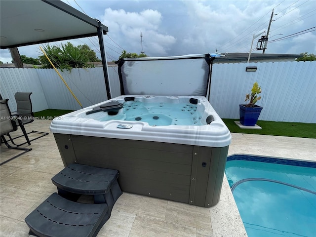 view of patio with a hot tub