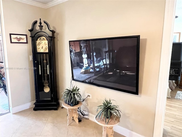 interior details with tile flooring and crown molding