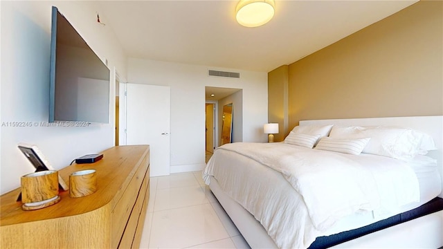 bedroom featuring light tile patterned floors