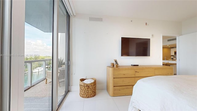 bedroom with light tile patterned floors