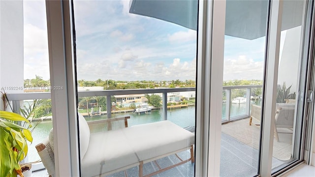 balcony featuring a water view